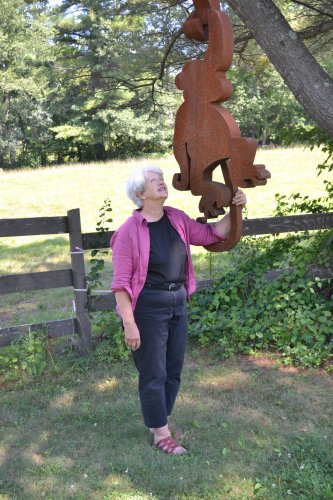 Pam Tarbell has even made friends with some of the sculptures she displays, like Monkeys, by Dale Rogers.