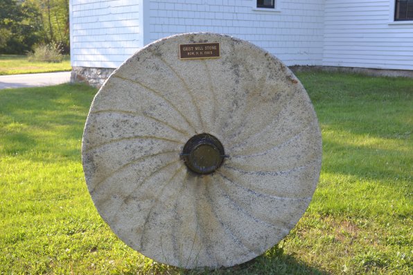 That’s a  grist mill stone, circa a long time ago.