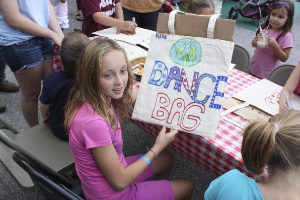 Ten-year-old Kara Laramee shows off the cool tote bag she designed during one of the children’s activities.