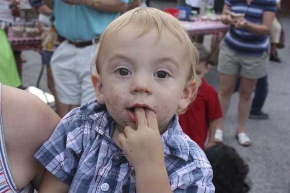 Henry Desrosiers, 1, may have gotten more of his chocolate ice cream on him than in him.