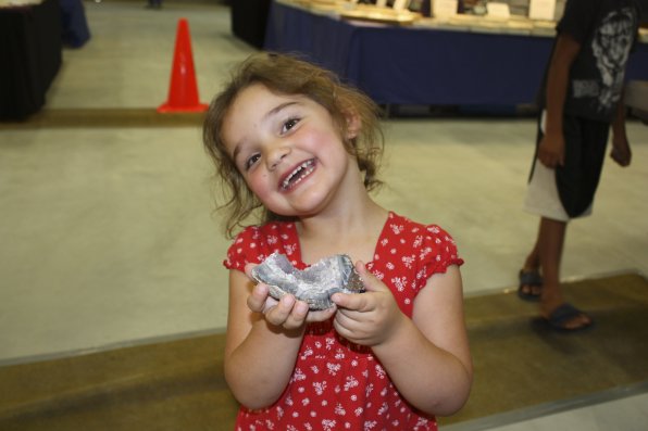 3-year-old Em Howes loves rocks! Here she is with a freshly split geode chunk.