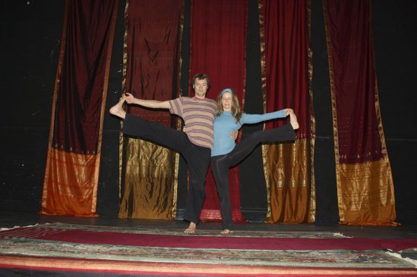 Asa Dustin and Nel Norwesh show us some yoga poses. Here, we see the hand to big toe pose.