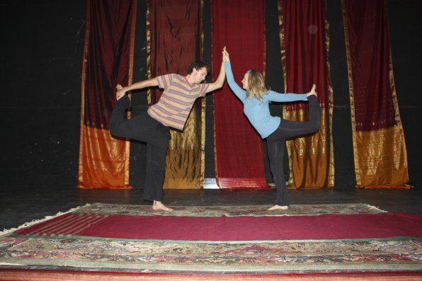 Asa Dustin and Nel Norwesh show us some yoga poses. Here, we see a dancer's pose.