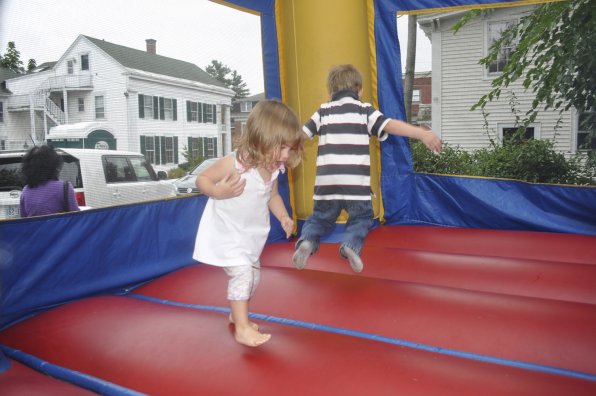 Molly Blanchard and Gabriel Dickinson enjoy the bouncy house.