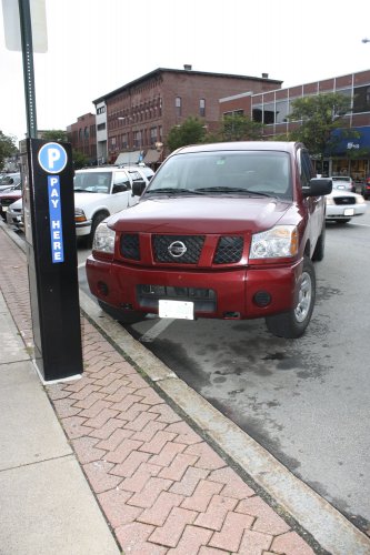 Come on, Concord, keep it between the lines! It’s tough enough to find a spot downtown as it is.