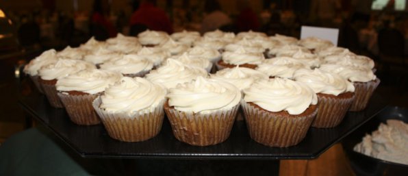 Pumpkin cupcakes with cream cheese frosting.