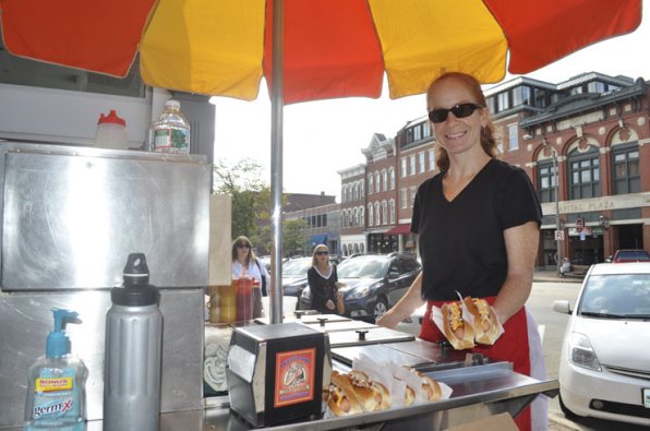 Gretchen Peters serves up a couple frankfurters at Puppy Love Hot Dogs.