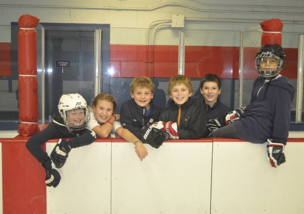 Lilly Vezina, 10; Darby Palisi, 10; Anders Norton, 9; Evan Makris, 10; Carter Gaglia, 10; and Chris Wells, 10, took a break while the Zamboni cleared the ice.