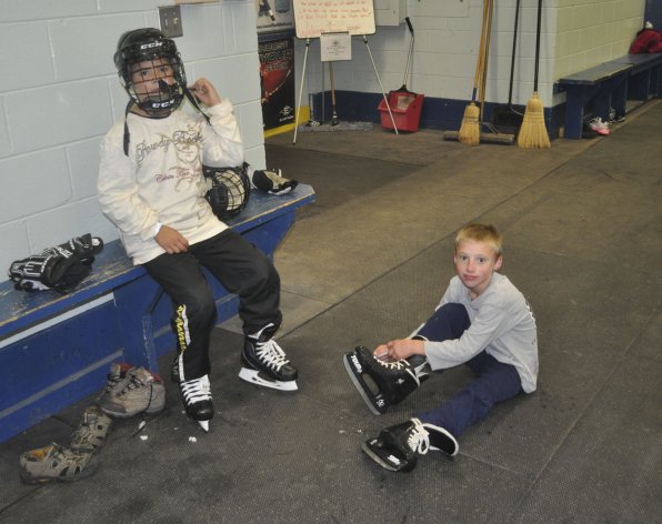 C. J. Escalara, 8, and Flynn Wintle, 8, lace ’em up for the first time this season.