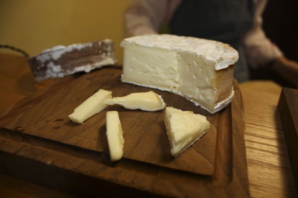 A wheel of Harbison cheese, rind bound with spruce wood.
