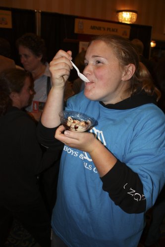 Boys & Girls Club member Sam Bruce, 15, digs in to an ice cream sundae.
