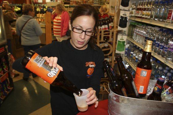 Meaghan Tolios pours a taster of Shipyard Smashed Pumpkin. Oh, the spices!