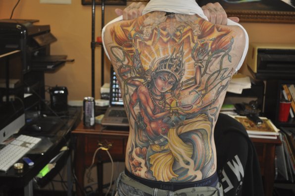 Ambose’s favorite piece, a back tattoo that took nearly a year.