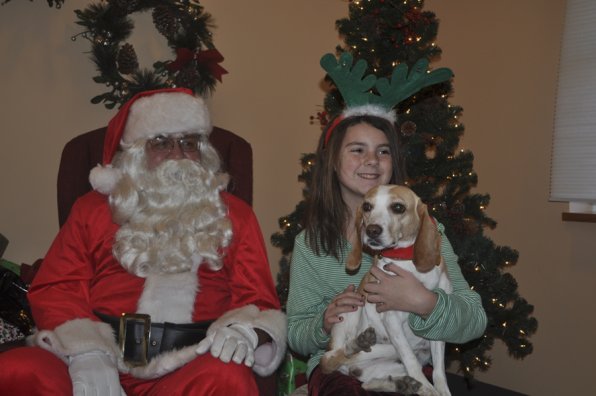 Ginger, a 3-year-old beagle, wanted a brand new doggie bed. She was more than happy to pose with her buddy, Stephanie Paquin, and Santa, in the meantime.