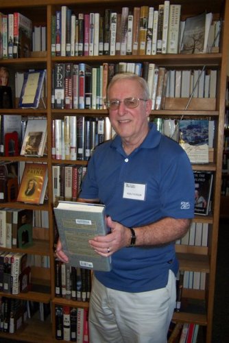 Robert Boley volunteers shelving returned books at the Concord Public Library.