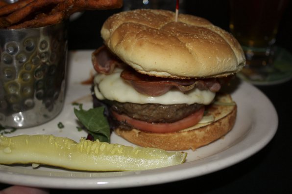 The SNOB Burger is piled high with tomato, prosciutto, tomato jam and haughty attitude.