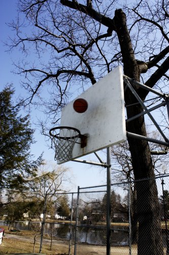<strong>White Park</strong> is truly a tale of two hoops. On one side, you have a perfect basket: a normal rim with a square metal backboard, a great shade tree and a nice view of the fountain. On the other side, a bent double rim next to an eroding hillside that actively deposits large quantites of sand onto the court.