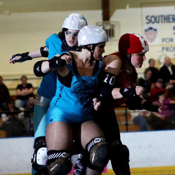 Deck and Rabid Ruby team up on an opposing skater. The Granite State Roller Derby season starts April 7 with a bout at Everett Arena. For more info, visit granitestaterollerderby.com.