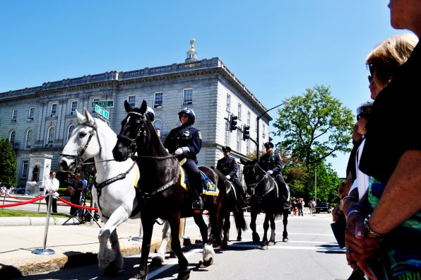 Officers on horseback lead the procession after the ceremony.