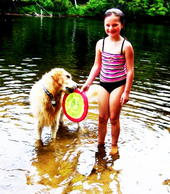 Alexis Johns of Penacook with her Contoocook River-loving dog, Oliver.