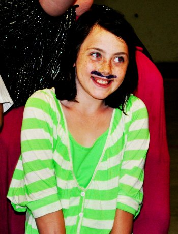 Shaylene Ekle, 10, took second place by combining her mustache with a shy smile.