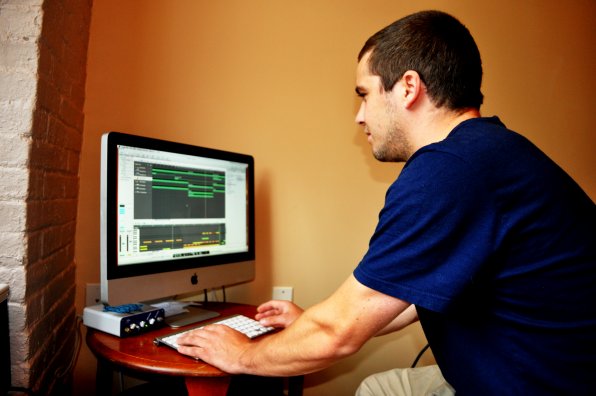 Eric Ober in his home studio, which consists of a computer and a desk chair (not pictured). Ober has experience in almost all genres of music but has recently used technology to create a series of pop songs under the name Pop Hustle. So no, he’s not playing Tetris.