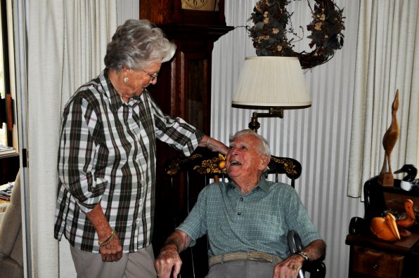 Ron Knee – with wife, Edie – didn’t carve that rocking chair out of wood, but he could have!