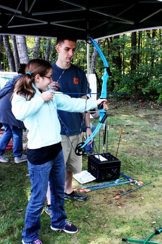 Anna Lafreniere, 10, tries her hand at archery. Bullseye!