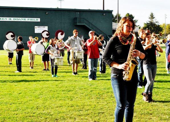 Kaitlyn Kelleher (right) and the Concord High School marching band practice in street clothes.