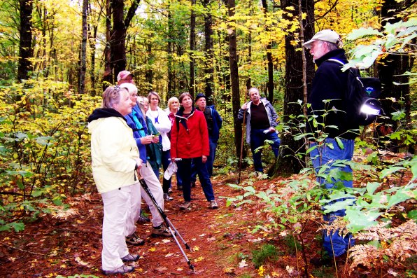 Kenneth Stern (right) addresses his hiking group, put together by the Osher Lifetime Learning Institute.