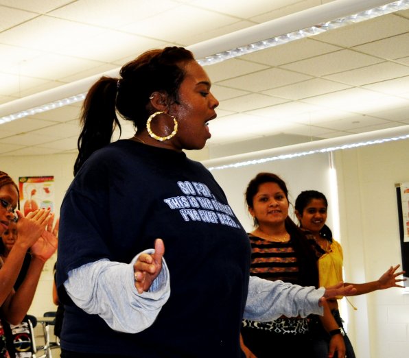 Dance instructor Shamecca Brown leads Concord High School students in the dance club.