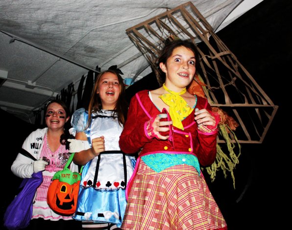 Madi Osburn, Kate Duval and Meredith Osburn catch a fright inside the YMCA haunted house.