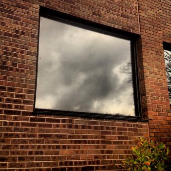 Those ominous clouds reflected in the window are the first signs of Superstorm Sandy rolling into Concord. Thanks, @atreecalledlife!