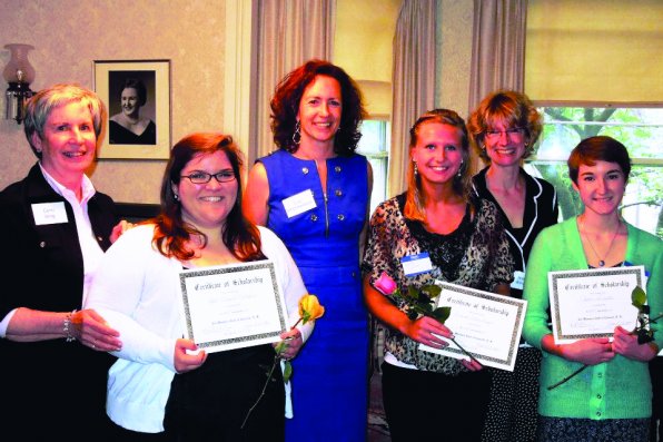 Woman’s Club President Lisa Schermerhorn (center) and members with some of the local students who received scholarships from the Woman’s Club.