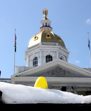 This yellow (golden?) egg is camping out on the State House lawn. To find it, look atop an a-peal-ing piece of history. Ring any bells? We hope so, because we are almost out of bell puns. Boy, that makes us feel like real idiophones.