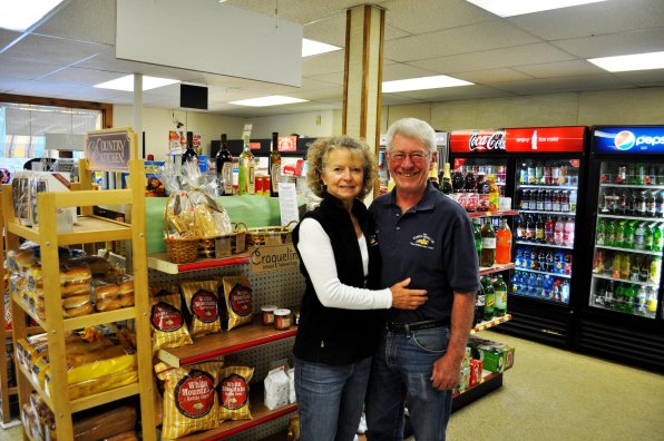 Gerri and Bob Hill, owners of the Korner Kupboard, next to several of their unique local products.