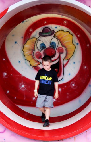 Tyler Carter, 5, exits the fun house.