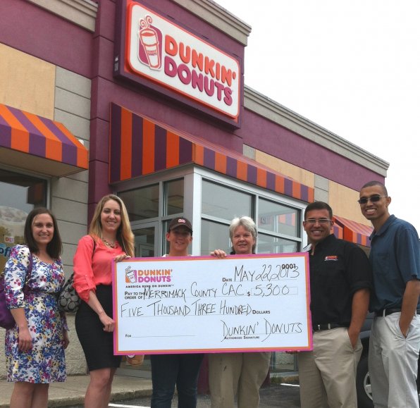 Merrimack County CAC’s Carissa Davis and Bethany Cottrell with Jamie Letourneau, Reaenn Horsman, Matthew Couto and Sean Baker-Cromwell of Dunkin’ Donuts at the 412 S. Main St. Dunkin’ Donuts.