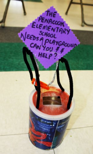 Mrs. Nadeau’s third-graders placed a hand-painted collection can into the capsule. Students used the can to raise over $1,200 for a new playground.