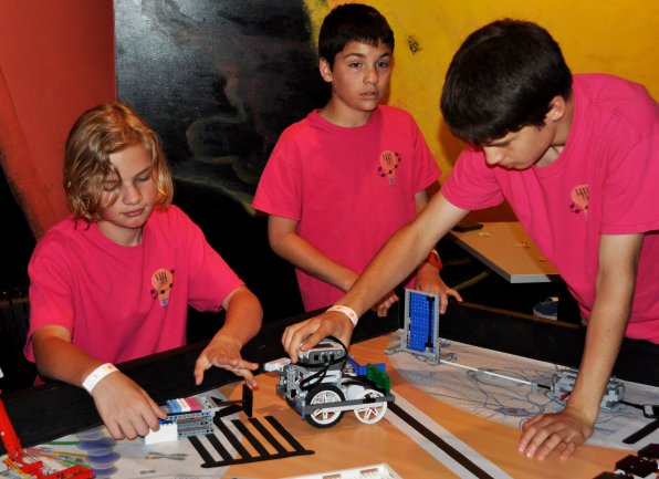 Jadon Rienstra, Grant Rienstra and Jakob Bair display a project from the First Lego League.