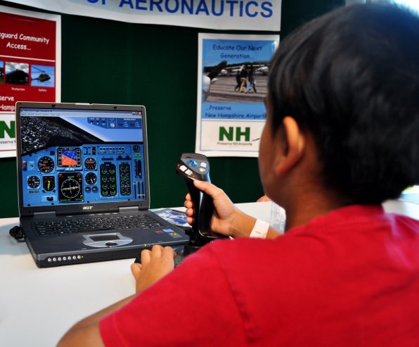 Akshay Manchanda, 6, gets his pilot on with a 737 Boeing flight simulator.