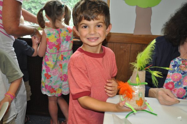 Robert Pappalardo, 6, was liberal with his application of feathery thingies.