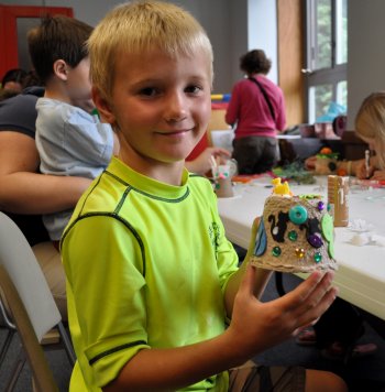Wyatt Evensen, 7, proudly displays his colorful creation.