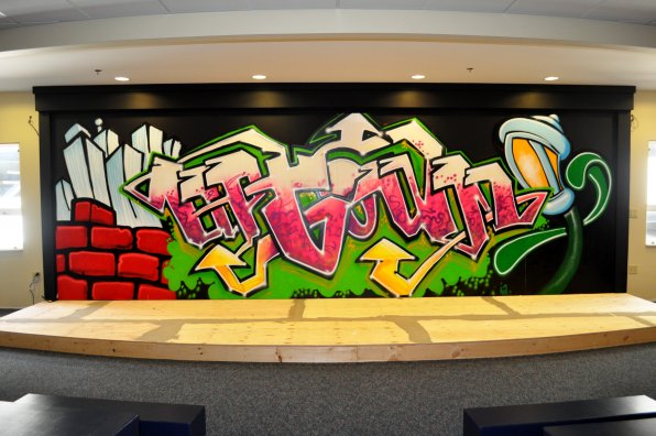 The stage in the redesigned church boasts a sweet graffiti mural.