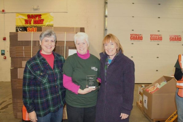 Angela Finney, center, recently received the 2013 Volunteer Hero Award. Finney is pictured with Maria Manus Painchaud, and Governor Maggie Hassan.