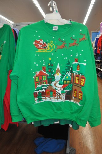 It's hard to beat the super-crowded holiday tableau on this sweater. It’s like we’re all living in Ugly Sweatshirt Village!