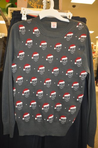Finally, a Christmas sweater featuring people without any flesh on their faces.
