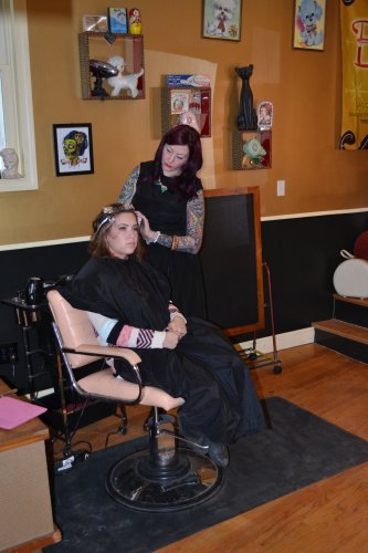 Beauty Lounge owner Carole houle gives first-time customer Brittany Monteith a color treatment.
