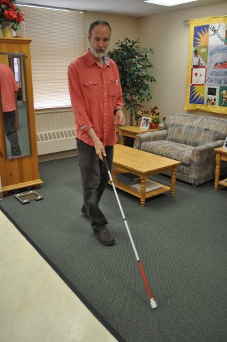 O’Connor demonstrates proper cane technique with a sweeping motion.