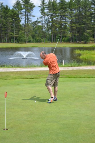 Keith demonstrates what we later found out was slightly exaggerated back swing for a short putt.